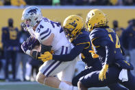 Kansas State tight end Ben Sinnott (34) is defended by West Virginia safetys Marcis Floyd and Malachi Ruffin (14) during the first half of an NCAA college football game in Morgantown, W.Va., Saturday, Nov. 19, 2022. (AP Photo/Kathleen Batten)