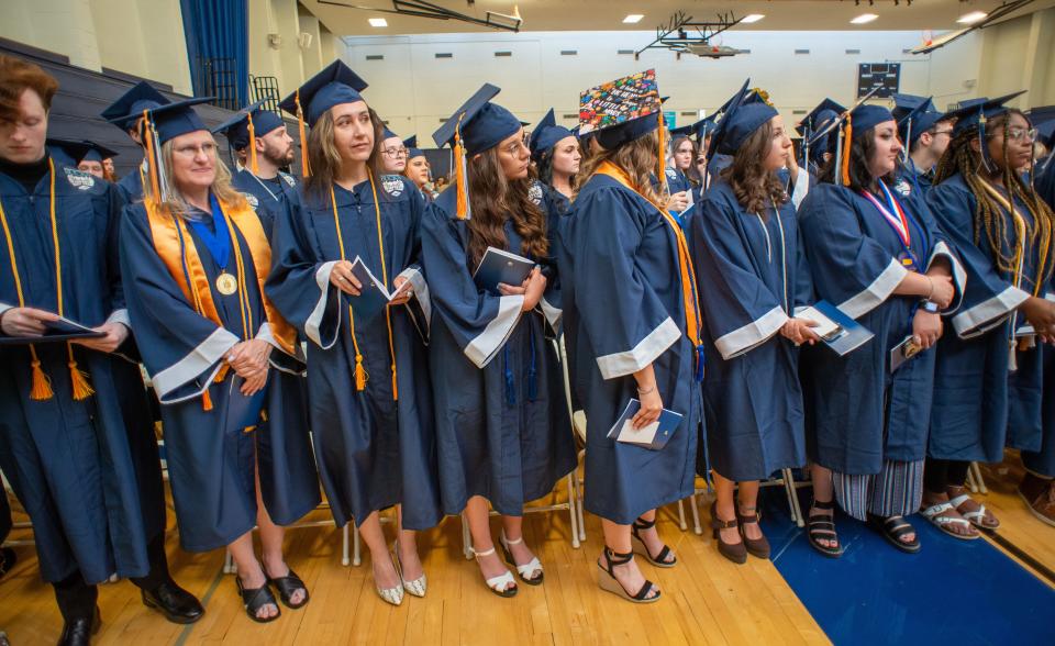 A group of graduates awaits their turn to walk and receive their diploma during the Bucks County Community College's 57 Annual Commencement Thursday, May 18, 2023 at Bucks County Community College in Newtown.