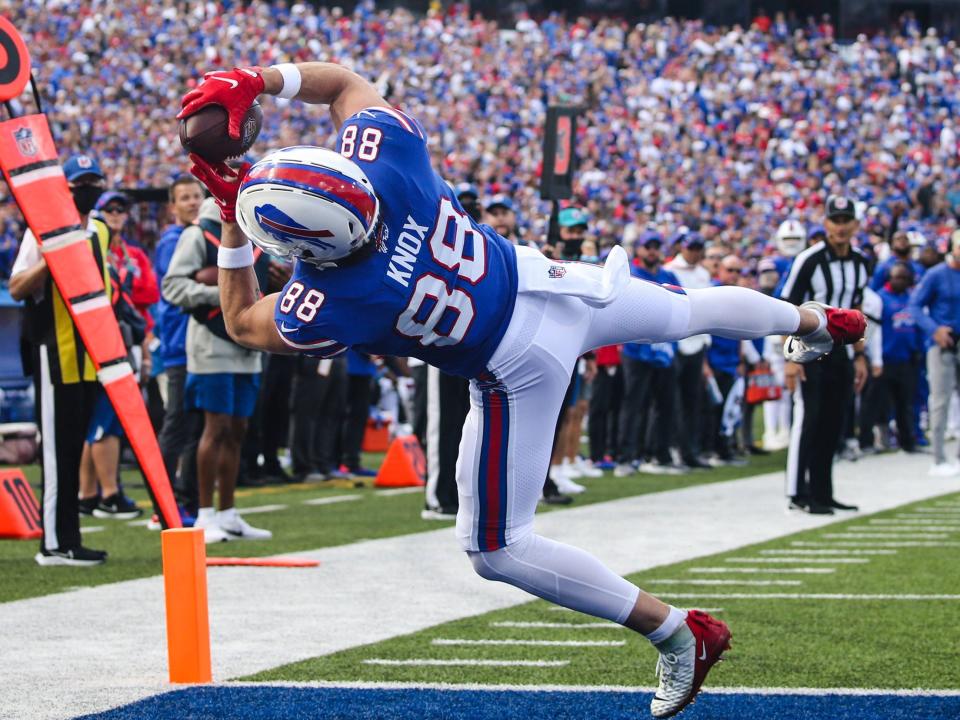 Dawson Knox scores a touchdown against Washington.