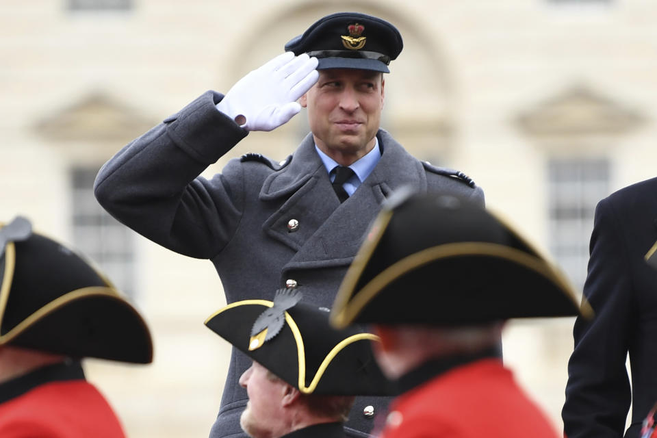 FILE - Prince William salutes veterans on Horse Guards Parade during the Remembrance Sunday service at the Cenotaph, in Whitehall, London, Sunday Nov. 14, 2021. The world watched as Prince William grew from a towheaded schoolboy to a dashing air-sea rescue pilot to a father of three. But as he turns 40 on Tuesday, June 21, 2022, William is making the biggest change yet: assuming an increasingly central role in the royal family as he prepares for his eventual accession to the throne. (Daniel Leal-Olivas/Pool via AP, FIle)