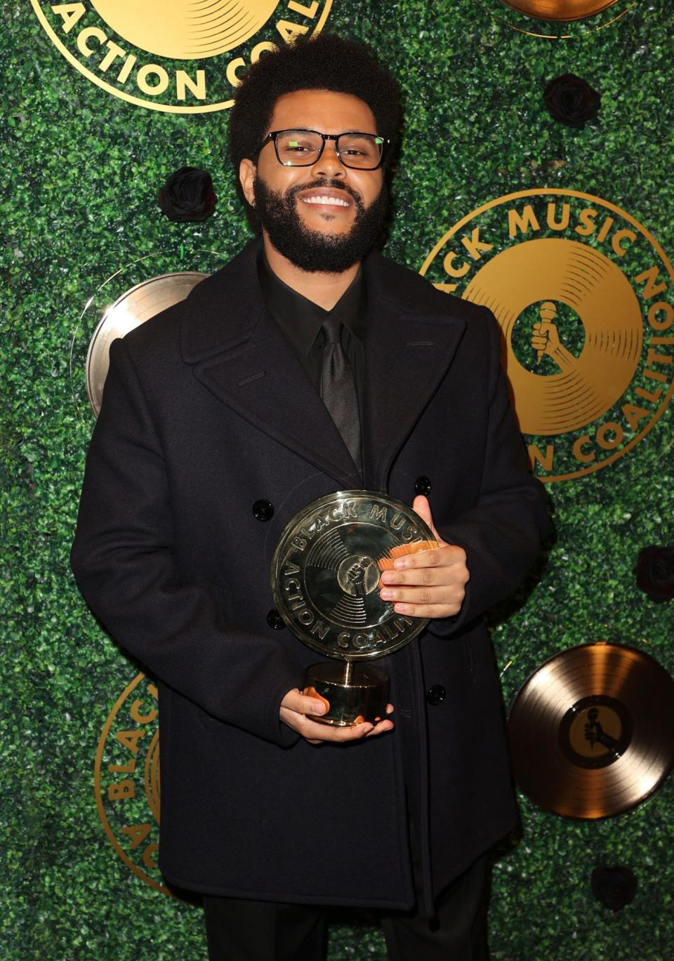 <p>The Weeknd shows off his new hardware on Sept. 23 after accepting the Quincy Jones Humanitarian Award from the Black Music Action Coalition at the Music in Action Awards at 1 Hotel West Hollywood. </p>