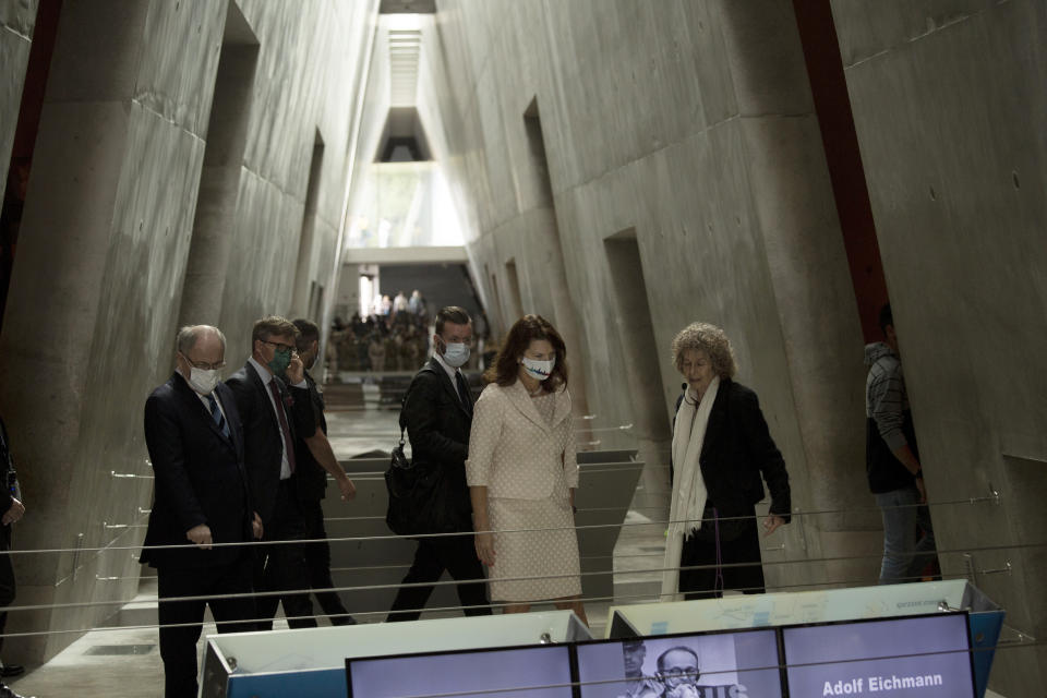 Swedish Foreign Minister Ann Linde, second from right, pauses at a display at the Yad Vashem Holocaust Memorial in Jerusalem, Monday, Oct. 18, 2021. (AP Photo/Maya Alleruzzo)