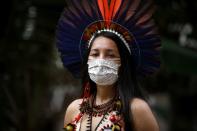 Samela Satere-Mawe, a 24-year-old biology student and Indigenous activist poses for pictures in Manaus