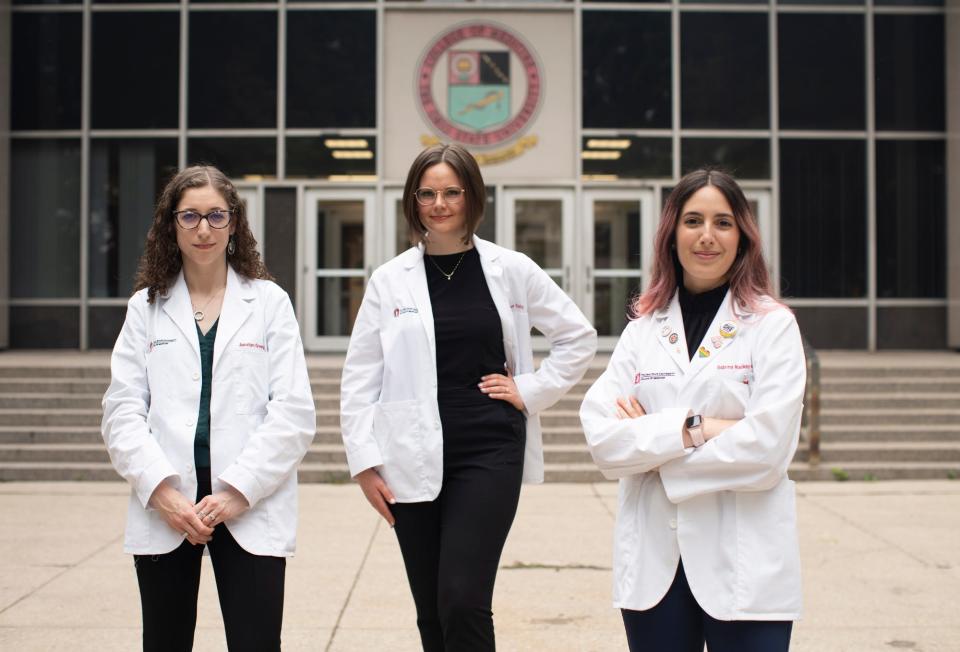 Ohio State students, from left, Jacelyn Greenwald, Dr. Kylene Daily, and Sabrina Mackey-Alfonso, have worked to improve Ohio State's medical school curriculum to include more training about how to treat and work with patients who have experienced sexual abuse.