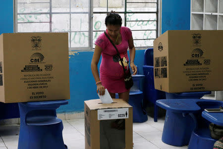 A woman casts her vote in a school used as a polling station during the presidential election, in Guayaquil, Ecuador April 2, 2017. REUTERS/Henry Romero