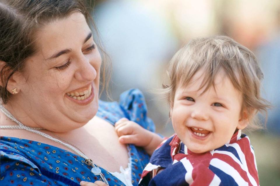 <p>Henry Diltz/Corbis via Getty</p> Cass Elliot and her daughter Owen at the Renaissance Pleasure Faire on May 14, 1968 in Agoura Hills, California.