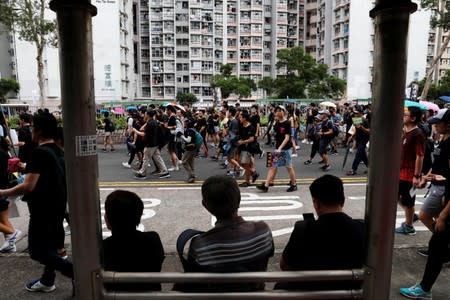 Anti-extradition bill protesters march at Tseung Kwan O residential district in Hong Kong