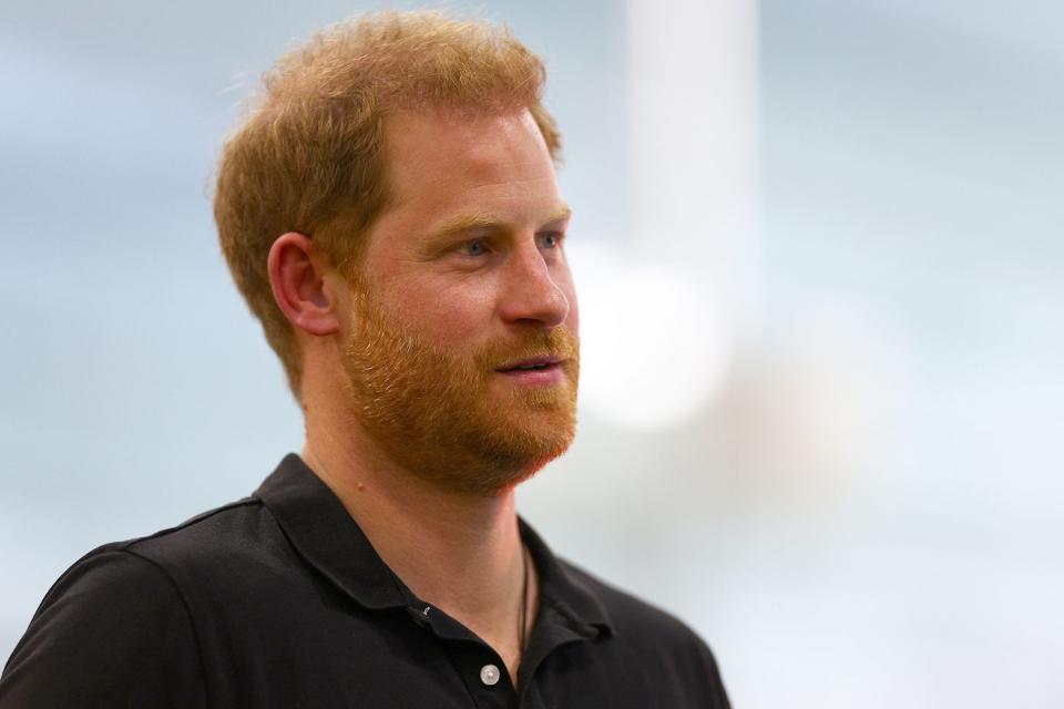 Prince Harry, Duke of Sussex looks on during the medal ceremony for the Women's 50m Breaststroke ISD during the Swimming on day four of the Invictus Games The Hague 2020 at Zuiderpark on April 19, 2022 in The Hague, Netherlands.