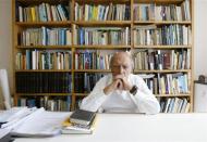 Brazilian architect, Oscar Niemeyer speaks at his office during an interview in Rio de Janeiro February 6, 2006. At 98, Niemeyer, whose modernist buildings and monuments are the centerpiece of Brazil's capital, still wants to surprise the world with new shapes of his beloved reinforced concrete. Picture taken on February 6, 2006. REUTERS/Bruno Domingos