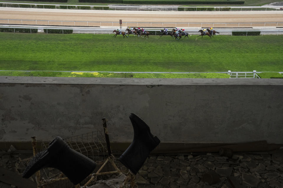 Abandoned tribunes as jockeys compete in last Macao races at the Macao Jockey Club in Macao, Saturday, March 30, 2024. After more than 40 years, Macao’s horse racing track hosted its final races on Saturday, bringing an end to the sport in the city famous for its massive casinos. (AP Photo/Louise Delmotte)