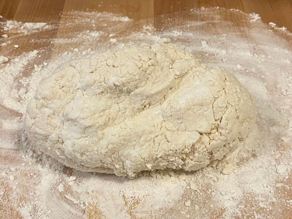 kneaded dough on a floured surface