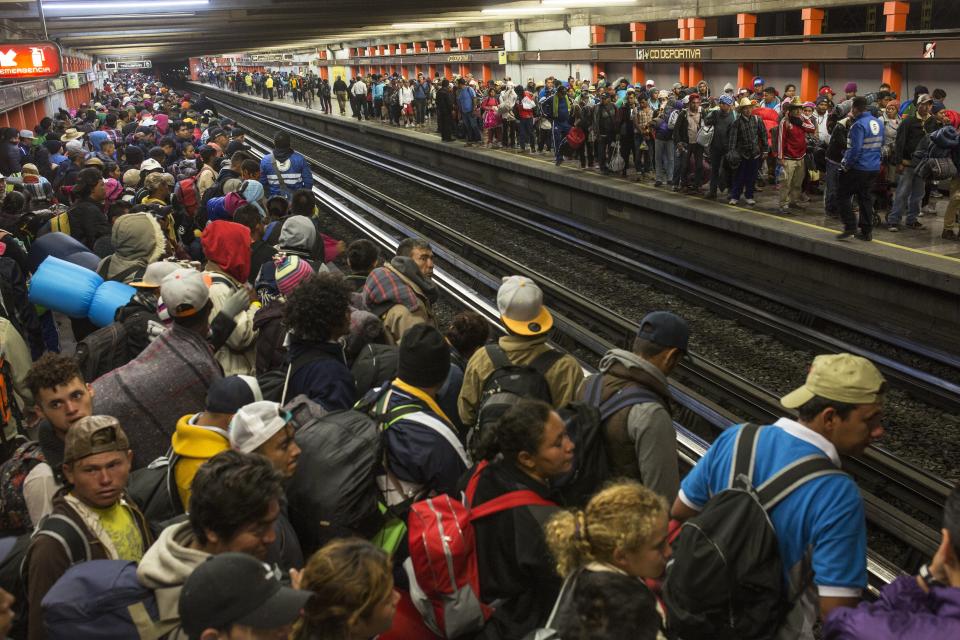 Central American migrants wait for subway cars as they resume their journey north after leaving the temporary shelter at the Jesus Martinez stadium, in Mexico City, Saturday, Nov. 10, 2018. Thousands of Central American migrants were back on the move toward the U.S. border Saturday, after dedicated Mexico City metro trains whisked them to the outskirts of the capital and drivers began offering rides north. (AP Photo/Rodrigo Abd)