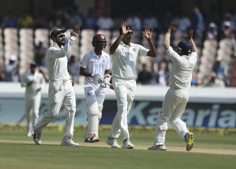 Indian bowler Ravichandran Ashwin celebrates the wicket of West Indies player Kieran Powell during the first day of the second cricket test match between India and West Indies in Hyderabad, India, Friday, Oct. 12, 2018. (AP Photo/Mahesh Kumar A.)