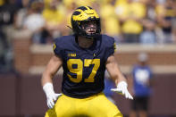 FILE - Michigan defensive end Aidan Hutchinson plays against Northern Illinois in the first half of a NCAA college football game in Ann Arbor, Mich., Saturday, Sept. 18, 2021. Michigan coach Jim Harbaugh said star defensive end Aidan Hutchinson should be strongly considered for the Heisman Trophy after he had three sacks, setting a single-season record for college football team, in a win over Ohio State that put the Wolverines in the Big Ten championship game and national title race. (AP Photo/Paul Sancya, File)