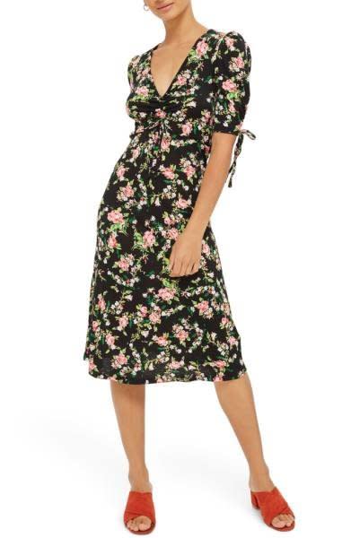 Shop it <strong><a href="http://shop.nordstrom.com/s/topshop-floral-ruched-midi-dress/4760730?origin=keywordsearch-personalizedsort&amp;fashioncolor=BLACK%20MULTI" target="_blank">here</a></strong>.