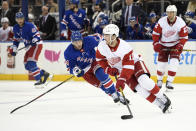 Detroit Red Wings right wing Filip Zadina (11) skates with the puck as New York Rangers center Greg McKegg (14) defends during the second period of an NHL hockey game, Friday, Jan. 31, 2020, in New York. (AP Photo/Sarah Stier)