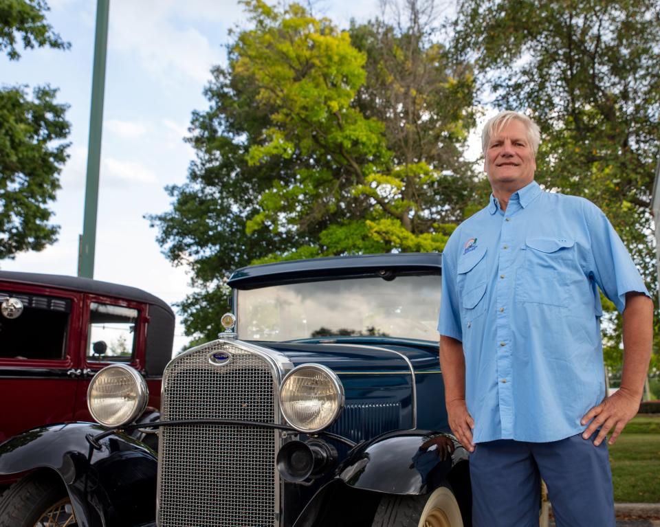 Roger Dutton poses in front of his Ford Model A, which was passed down two generations to him after being bought new at a dealership.