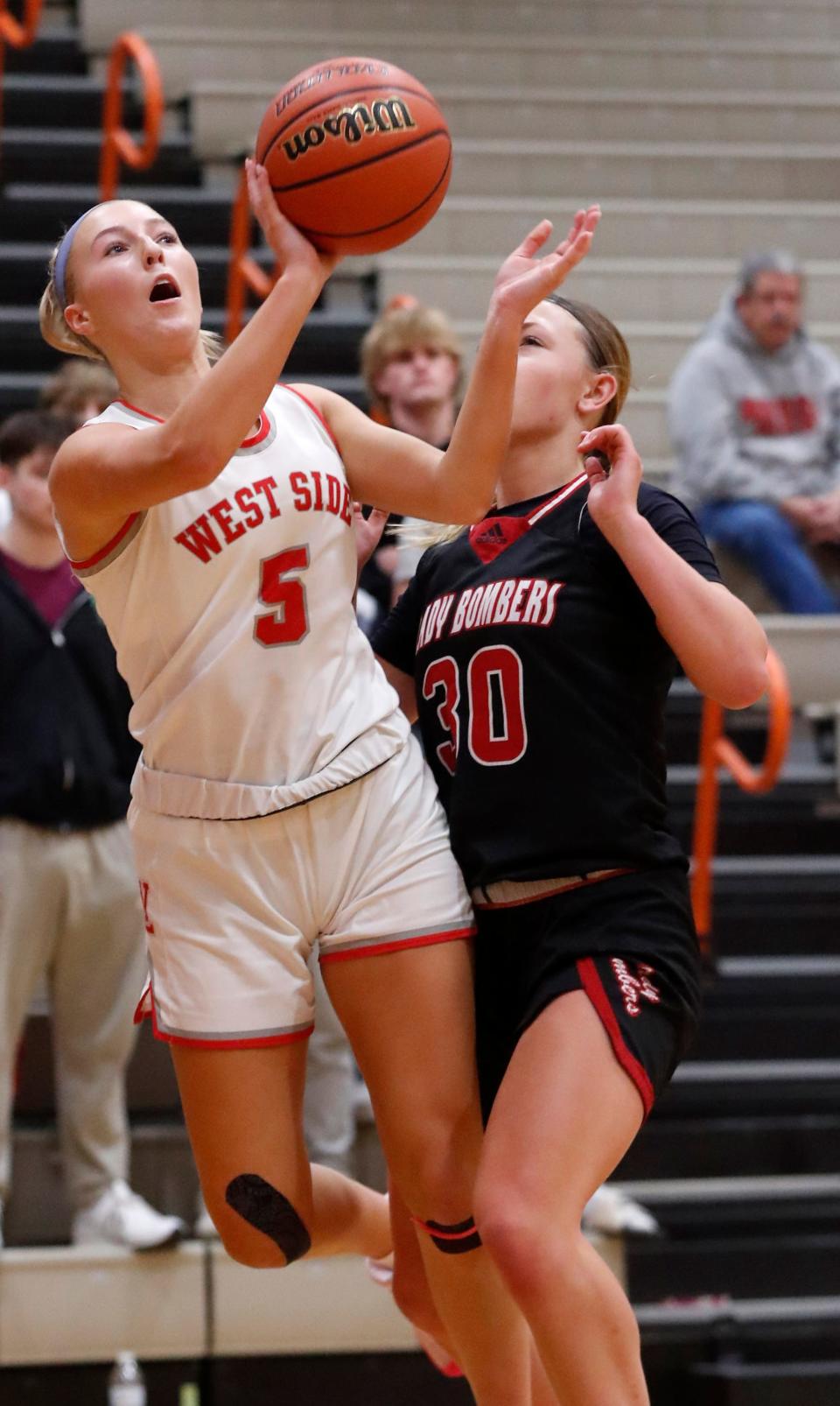 West Lafayette Red Devils Sarah Werth (5) shoots the ball while being guarded by Rensselaer Central Bombers Kamri Rowland (30) during the IU Health Hoops Classic Girl’s Basketball Championship, Saturday, Nov. 18, 2023, at Harrison High School in West Lafayette, Ind. Rensselaer Central Bombers won 58-53.