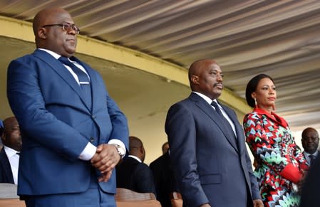 FILE PHOTO: Democratic Republic of Congo's outgoing President Joseph Kabila and his successor Felix Tshisekedi take part in the latter's inauguration ceremony in Kinshasa