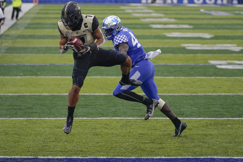 Vanderbilt wide receiver Cam Johnson (7) catches the ball and scores a touchdown during the second half of an NCAA college football game against Kentucky, Saturday, Nov. 14, 2020, in Lexington, Ky. (AP Photo/Bryan Woolston)