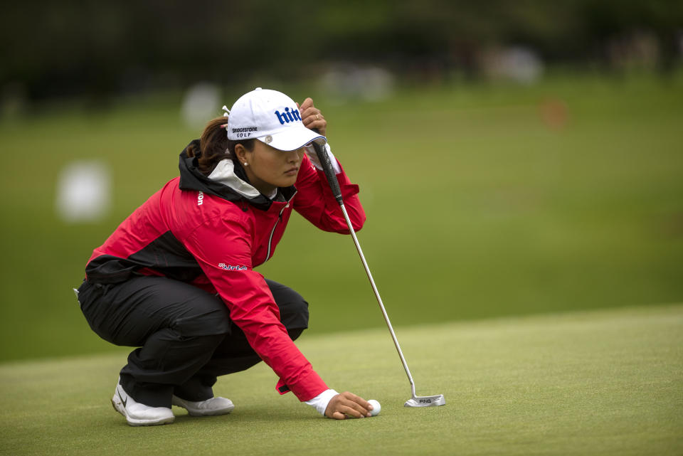 Jin Young Ko, of South Korea, lines up her putt on the first hole, during the first round of the Meijer LPGA Classic golf tournament at Blythefield Country Club on Thursday, June 13, 2019, in Belmont, Mich. (Alyssa Keown/The Grand Rapids Press via AP)