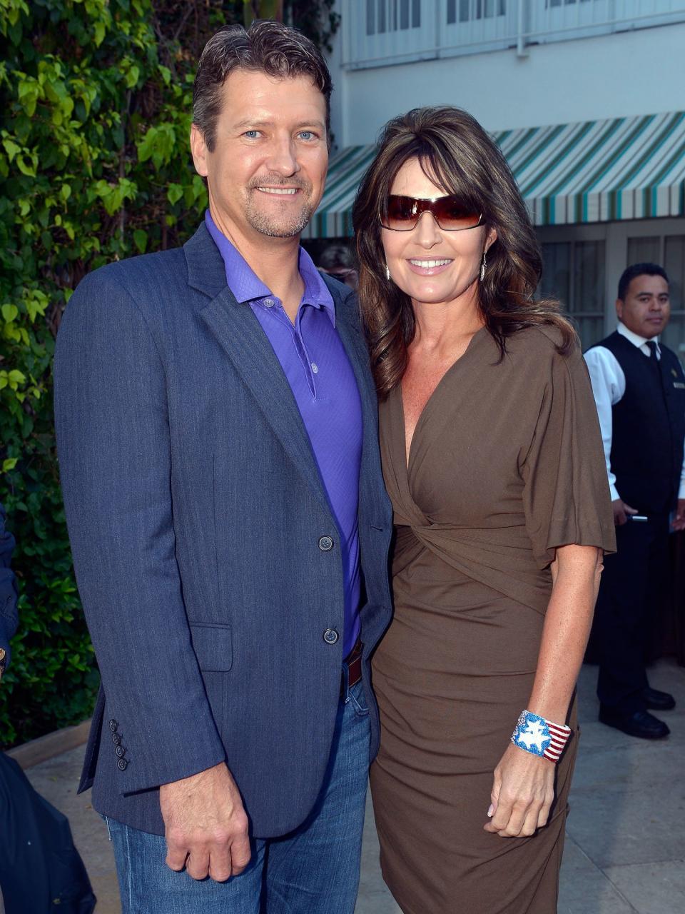 From left: Todd and Sarah Palin in August 2012 doing press for NBC's competition series <em>Stars Earn Stripes</em>, on which Todd was appearing. The Palins remade themselves as TV stars after Sarah left political office.