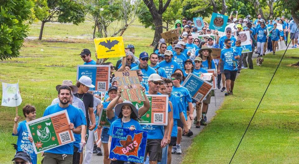 A large group of South Florida residents marched together to the Zoo entrance during a rally led by Ron Magill, the communications director at Zoo Miami to convince the Miami-Dade commission to vote against the controversial plan to build the Miami Wilds water park next to Zoo Miami, on Saturday November 04, 2023.