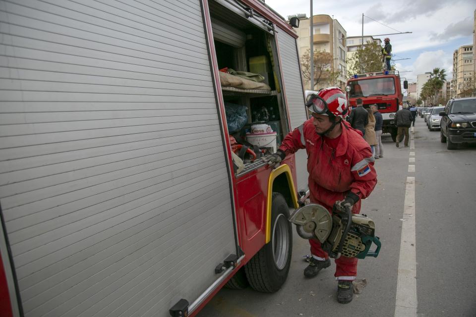 In this photo taken on Friday, Nov. 29, 2019, a rescuer from Serbia operates at a collapsed building after the 6.4-magnitude earthquake in Durres, western Albania. In the initial hours after a deadly pre-dawn earthquake struck Albania, pancaking buildings and trapping dozens of sleeping people beneath the rubble, the country’s neighbors sprang into action. Offers of help flooded in from across Europe and beyond, with even traditional foes setting aside their differences in the face of the natural disaster. The 6.4-magnitude earthquake that struck Albania on Tuesday killed at least 49 people, injured 2,000 and left at least 4,000 homeless. (AP Photo/Visar Kryeziu)