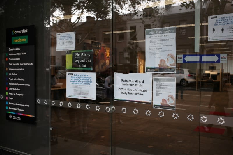 FILE PHOTO: Signs are seen outside a Centrelink office in Sydney