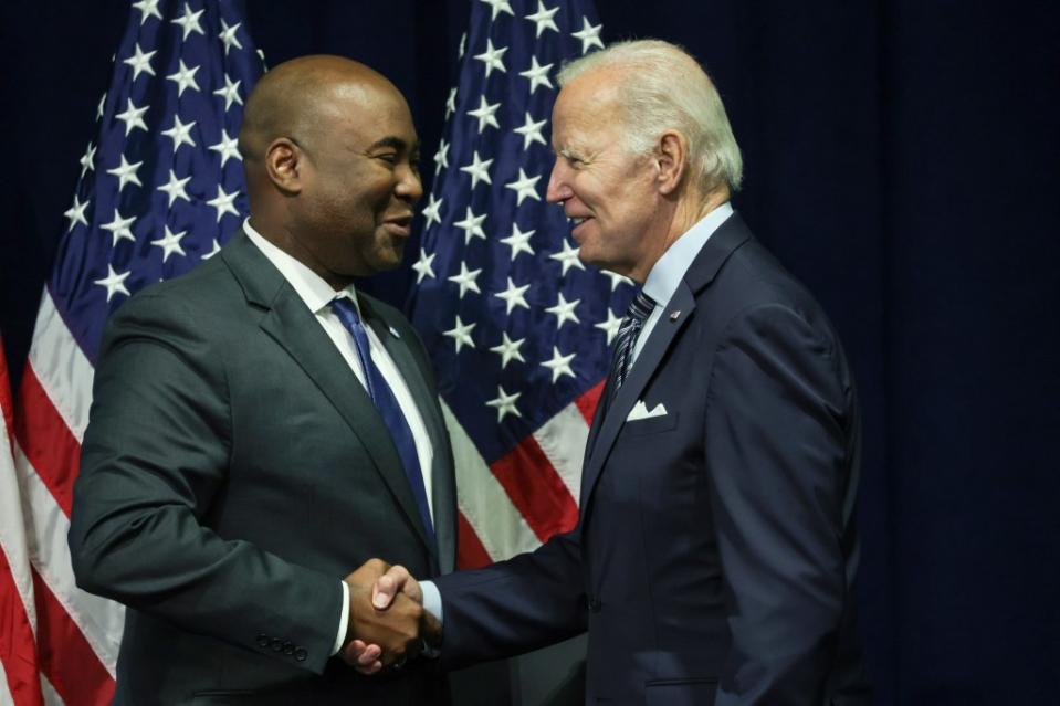 U.S. President Joe Biden (R) greets Jaime Harrison, chairman of the Democratic National Committee, at the organization’s summer meeting on September 8, 2022, in National Harbor, Maryland. (Photo by Alex Wong/Getty Images)