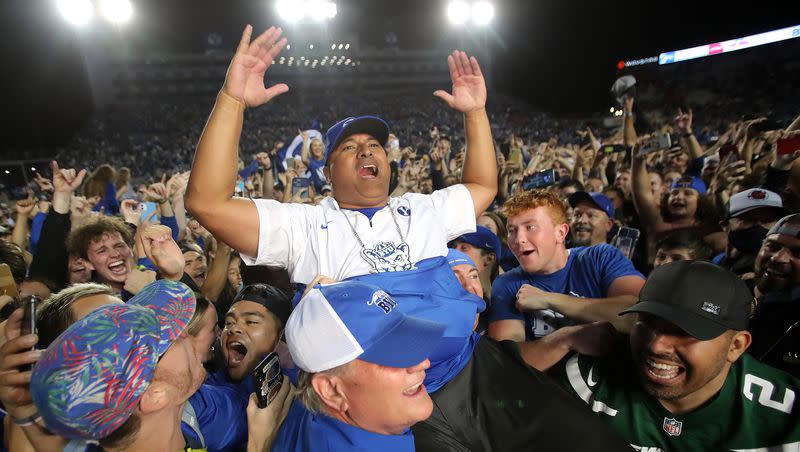 BYUCougars head coach Kalani Sitake celebrates the win as he is lifted into the air by fans after BYU defeated Utah in a football game at LaVell Edwards Stadium in Provo on Saturday, Sept. 11, 2021. BYU won 26-17, ending a nine-game losing streak to the Utes.