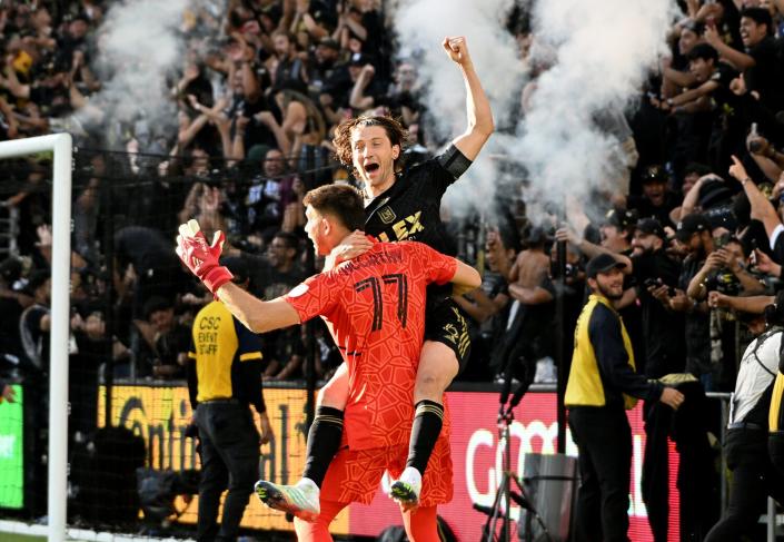LAFC goalie John McCarthy celebrates with Ilie Sánchez during Saturday's MLS Cup win over Philadelphia.
