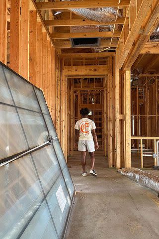 <p>Simone Biles/Instagram</p> Jonathan Owens walking through his under-construction home in September.