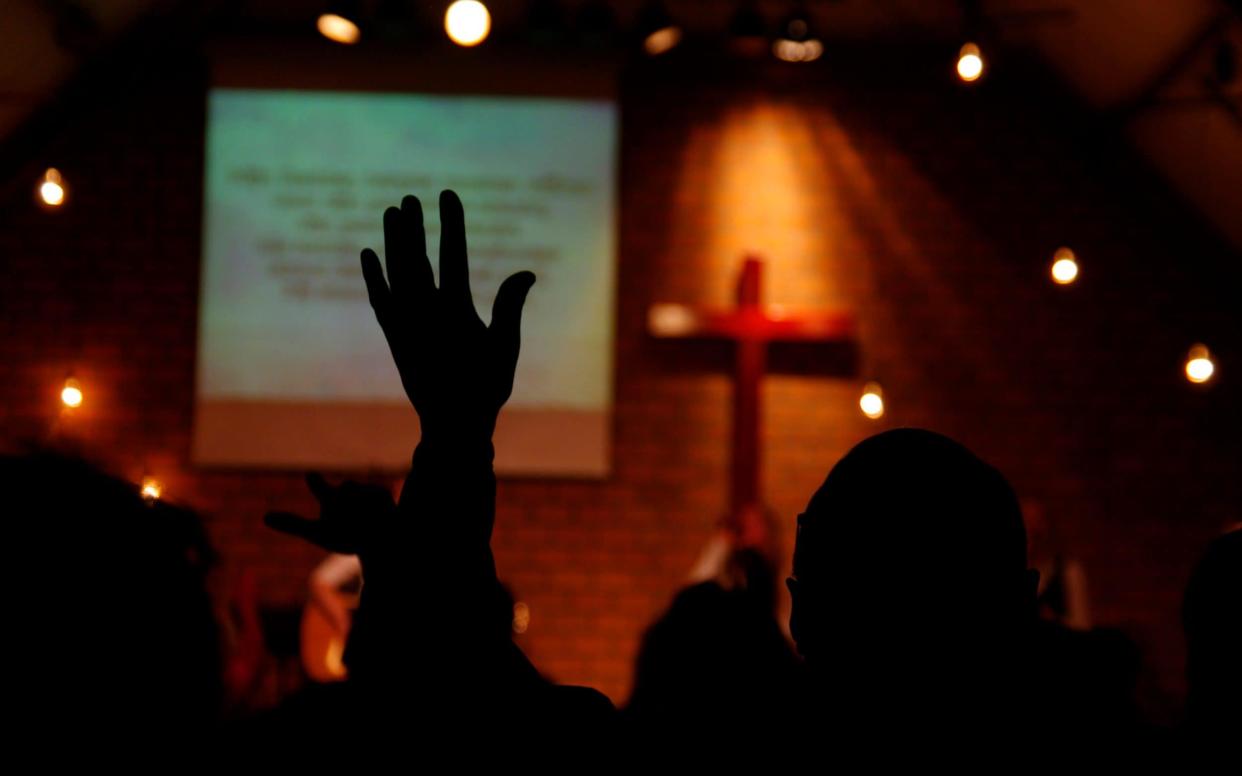 Praise event in a church - iStockphoto