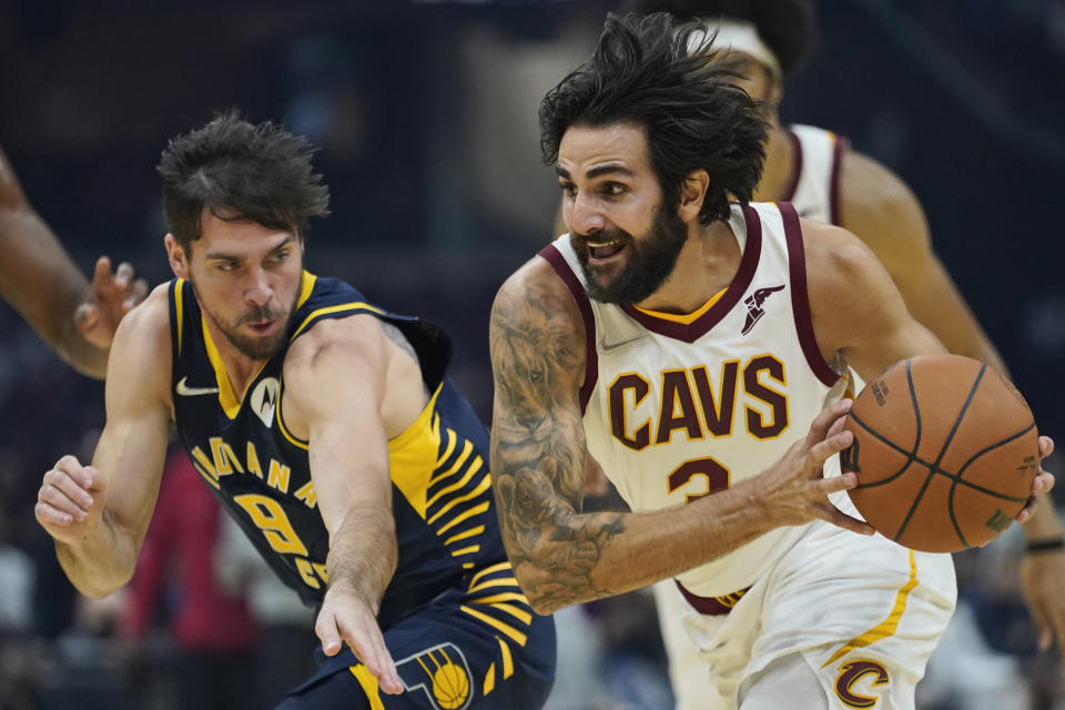 Cleveland Cavaliers' Ricky Rubio (3) drives past Indiana Pacers' T.J. McConnell (9) in the first half of an NBA basketball preseason game, Friday, Oct. 8, 2021, in Cleveland. (AP Photo/Tony Dejak)