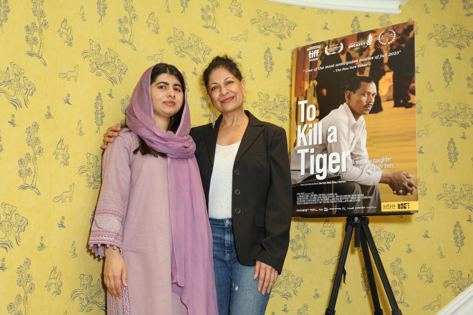 Malala Yousafzai and director Nisha Pahuja attend a special screening of the Oscar-nominated film "To Kill A Tiger" at The Covent Garden Hotel on February 20, 2024 in London, England.