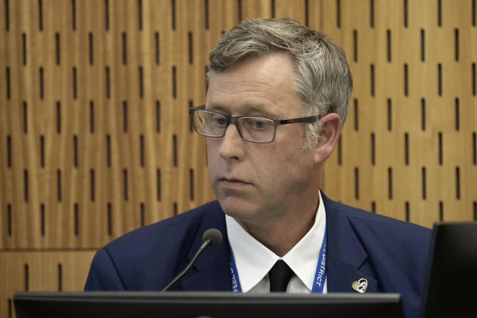 Detective Senior Sergeant Craig Farrant gives evidence during a coroner's inquiry in Christchurch, New Zealand, Tuesday, Oct. 24, 2023, into the 2019 mosque shootings. The inquiry into New Zealand’s worst mass-shooting will examine, among other issues, the response times of police and medics and whether any of the 51 people who were killed could have been saved. (Iain McGregor/Pool Photo via AP)