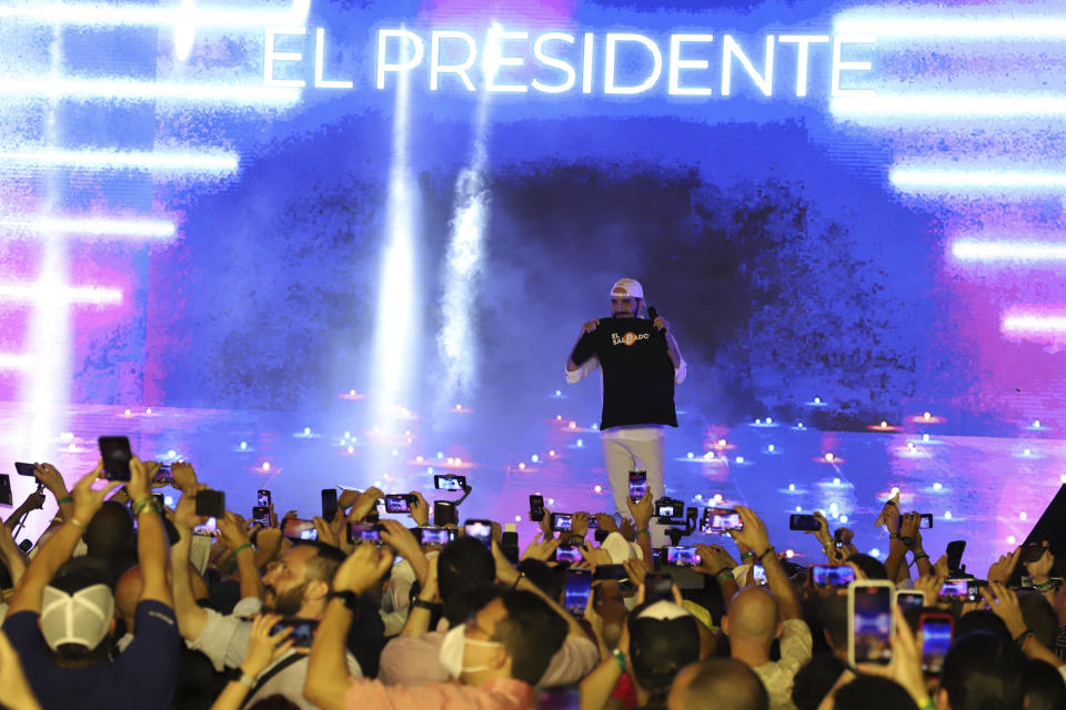 El Salvador's President Nayib Bukele participates in the closing ceremony of a congress for cryptocurrency investors in Santa Maria Mizata, El Salvador, Saturday, Nov. 20, 2021. Bukele announced during the rock concert-like atmosphere at the gathering that his government will build an oceanside "Bitcoin City" at the base of a volcano. (AP Photo/Salvador Melendez)