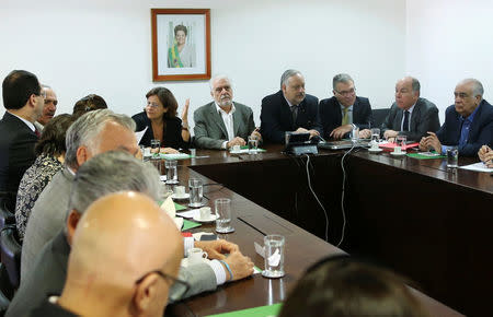 Ministers of Brazil's President Dilma Rousseff (not pictured) attend a meeting at Planalto Palace in Brasilia, Brazil May 11, 2016. REUTERS/Adriano Machado