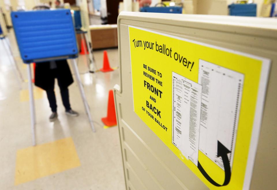 An Akron resident votes early at the Summit County Board of Elections.