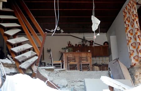 The interior of a house is seen after a quake in Amatrice, central Italy, August 24, 2016. REUTERS/Remo Casilli