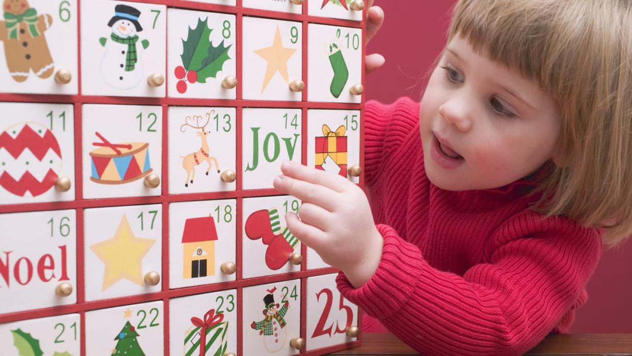 small girl with advent calendar
