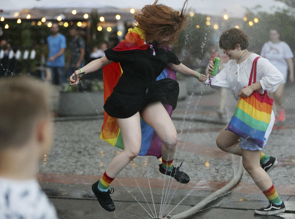 People take part in a gay pride parade in Warsaw, Poland, on Saturday, June 8, 2019. The Equality Parade is the largest gay pride parade in central and Eastern Europe. It brought thousands of people to the streets of Warsaw at a time when the LGBT rights movement in Poland is targeted by hate speeches and a government campaign depicting it as a threat to families and society. (AP Photo/Czarek Sokolowski)