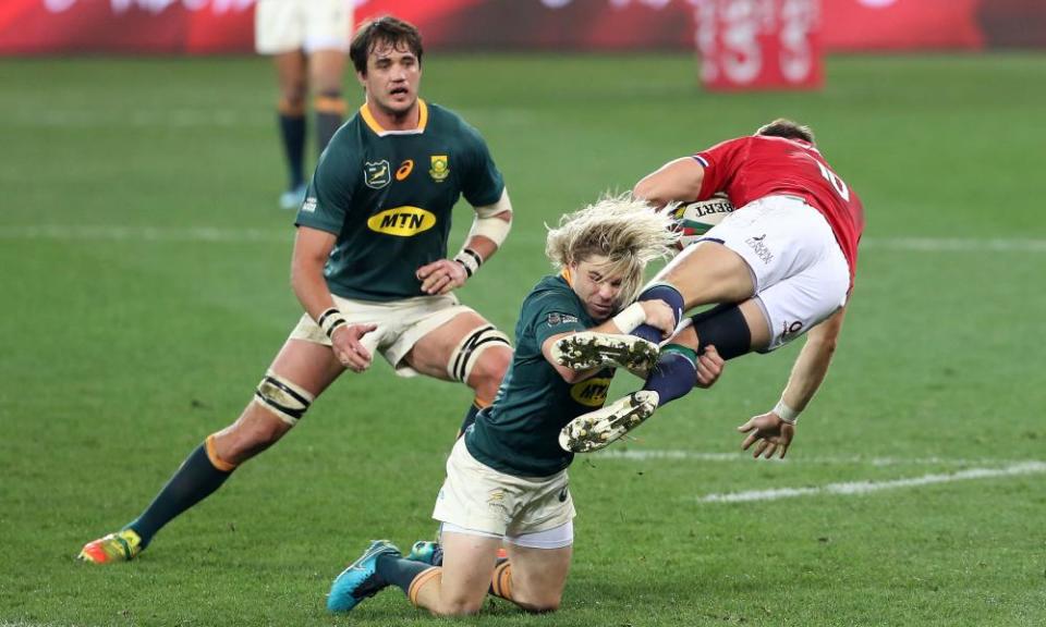 South Africa’s Faf de Klerk tackles the Lions’ Dan Bigger.