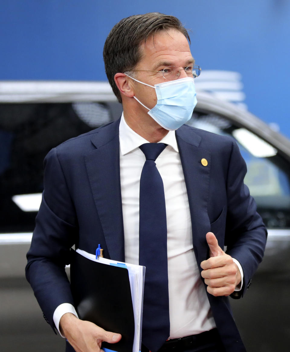 FILE - In this file photo dated Friday, Oct. 2, 2020, Dutch Prime Minister Mark Rutte arrives for an EU summit at the European Council building in Brussels. The Netherlands is holding a general election over three days starting March 15 2021 because of fears that busy polling stations could spike infections, which comes after Prime Minister Mark Rutte has spent more than a decade in power. (AP Photo/Olivier Matthys, FILE)