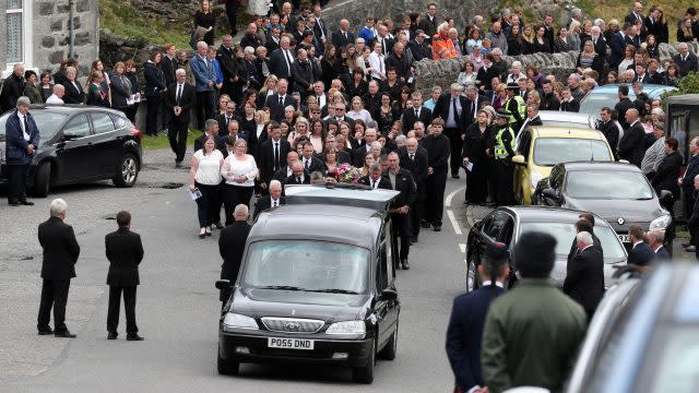 Mourners follow the funeral procession of Eilidh MacLeod after the service at Church of Our Lady, Star of the Sea, in Castlebay on the island of Barra