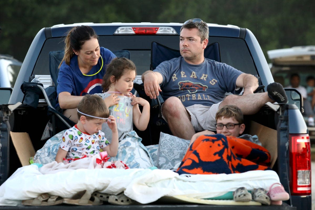 The Roer family of South Beloit get settled in the back of their pickup truck at The Drive 815 drive-in movie theater Saturday, June 12, 2021, set up in the Rockton Athletic Fields. The Drive 815 has returned for a second season this summer.