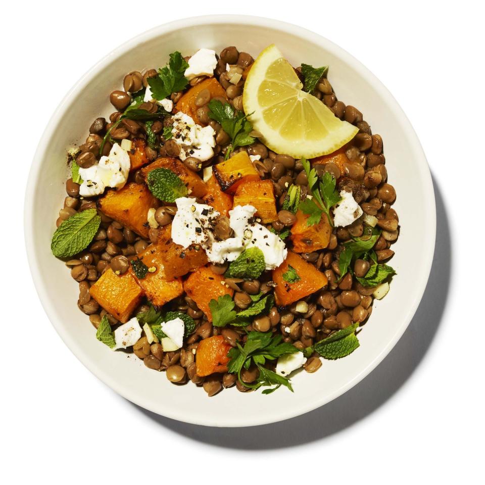 <p>Recharge batteries - This vegan dish will keep up your energy levels, thanks to the fibre in lentils, which stabilises blood sugar.</p><p><strong>Serves 1; </strong><strong>423 kcals; 35g fat; 8g protein; 24g carbs</strong></p><p><strong>Ingredients: </strong></p><p>2 tbsp extra virgin olive oil</p><p>1-2 garlic cloves, finely chopped </p><p>2 tbsp lemon juice </p><p>½ tbsp apple cider vinegar</p><p>½ tsp ground cumin</p><p>1/4 tsp ground all spice</p><p>70g cooked green or brown lentils </p><p>70g roasted butternut squash cubes</p><p>35g fresh mint, finely chopped </p><p>35g fresh parsley, finely chopped </p><p>2 tbsp almond feta (use normal if you’re not vegan)</p><p>Salt and freshly ground black pepper</p><p><strong>Method: </strong></p><p>1. In a small frying pan, heat 1 tbsp of the olive oil over a medium heat. Add the garlic and cook on a low heat until fragrant but not yet browned – 7-8 mins. Turn off the heat.</p><p>2. Meanwhile, whisk the lemon juice, the remaining olive oil, apple cider vinegar, cumin and allspice. This is your dressing. </p><p>3.Turn the heat back to medium and add the lentils, squash and dressing to the garlic, stirring gently. </p><p>4. Remove from the heat and top with the mint, parsley and feta. Season to taste, then serve.<br></p>