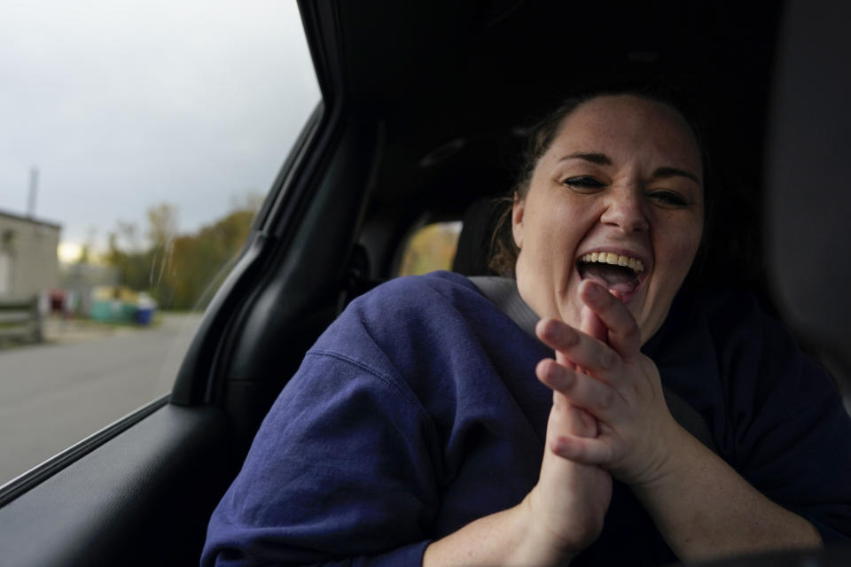 Heather Jarvis reacts in the back seat of a vehicle after being released from Ohio Reformatory for Women, in Marysville, Ohio, Wednesday, Oct. 25, 2023. Jarvis is part of the fastest-growing prison population in the country, one of more than 190,000 women held in some form of confinement in the United States as of this year. Their numbers grew by more than 500% between 1980 and 2021. (AP Photo/Carolyn Kaster)