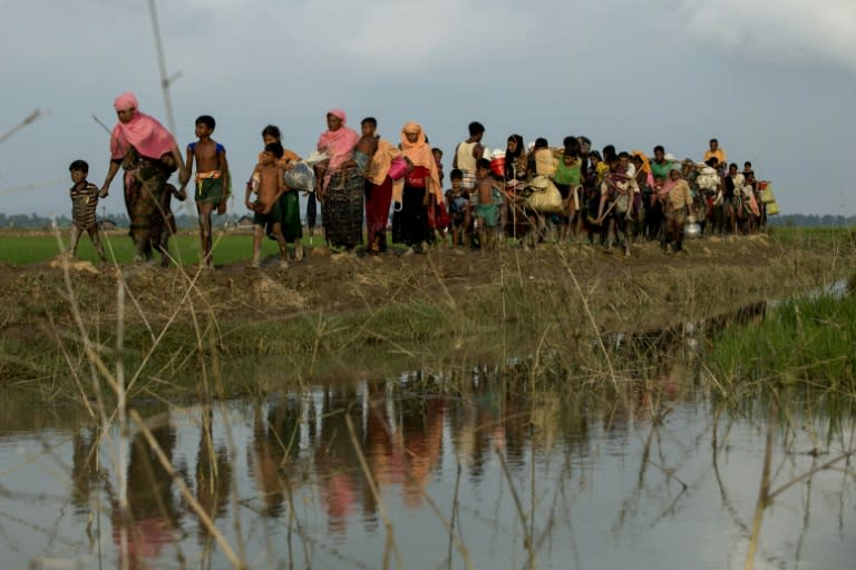 Rohingya refugees fleeing unrest in Myanmar have told stories of soldiers and Buddhist mobs burning entire villages to the ground, while the government blames militants for the arson